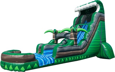  Angled image of a 22' water slide in a front yard. Water slide shaped like a wave with two palm trees in the middle of the slide and a pool at the end. 